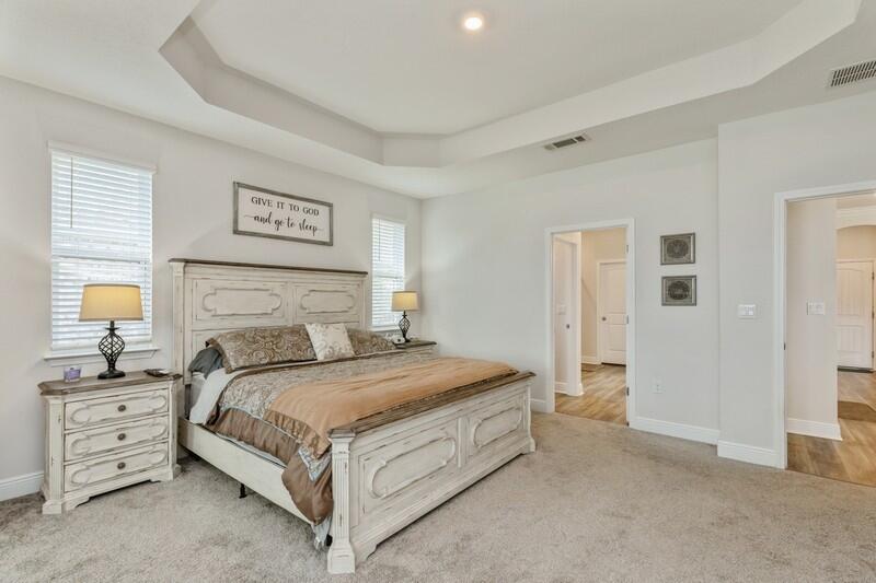 221 Sweet Tea Lane Freeport, FL 32439 - Photo 17 of 55 a bedroom with a bed and dresser