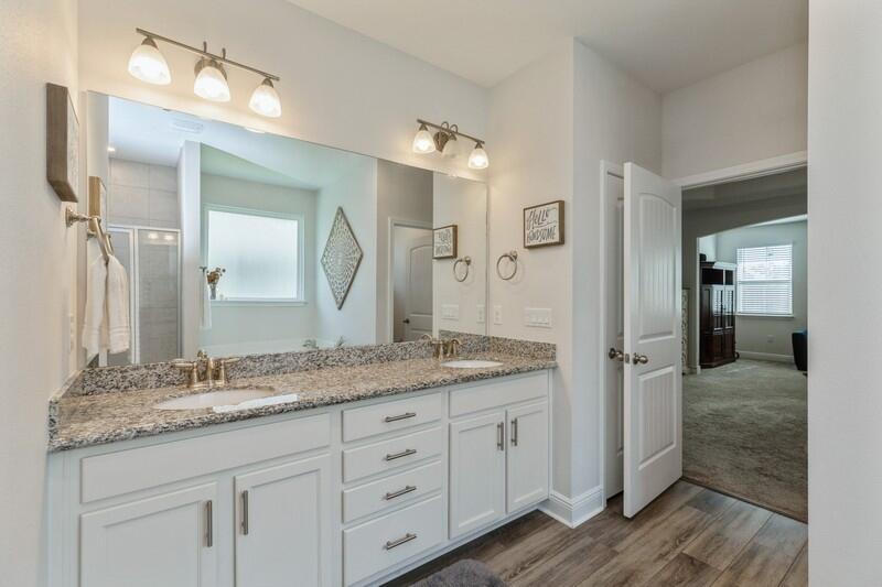 221 Sweet Tea Lane Freeport, FL 32439 - Photo 21 of 55 a bathroom with a granite countertop sink double and mirror