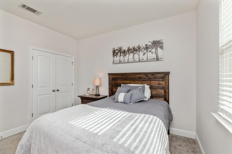 221 Sweet Tea Lane Freeport, FL 32439 - Photo 23 of 55 a bedroom with a large bed and a window