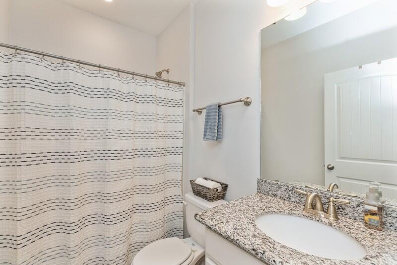 221 Sweet Tea Lane Freeport, FL 32439 - Photo 24 of 55 a bathroom with a granite countertop sink a toilet and shower