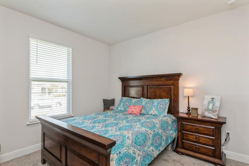 221 Sweet Tea Lane Freeport, FL 32439 - Photo 25 of 55 a bedroom with a bed and windows