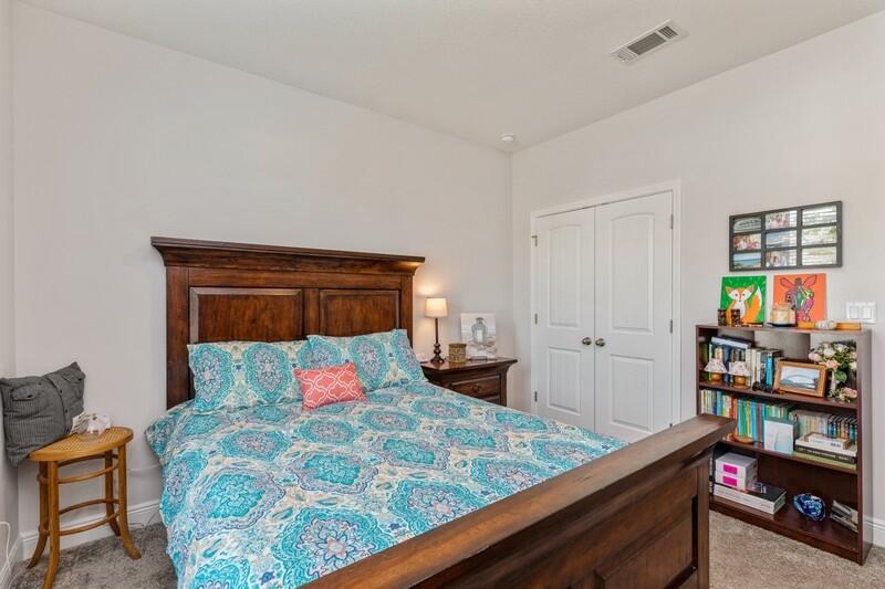 221 Sweet Tea Lane Freeport, FL 32439 - Photo 26 of 55 a bedroom with a bed and wooden floor