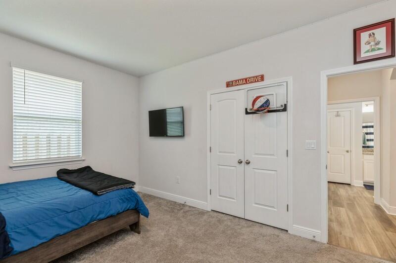 221 Sweet Tea Lane Freeport, FL 32439 - Photo 27 of 55 a spacious bedroom with a bed and a window