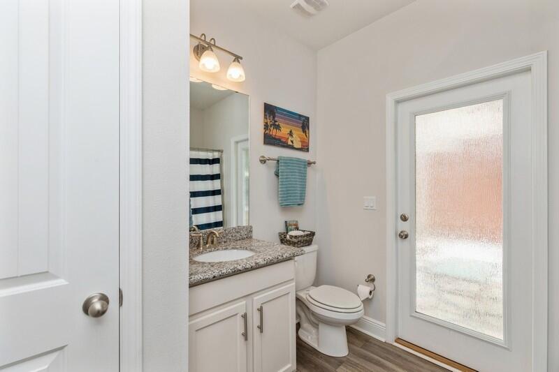 221 Sweet Tea Lane Freeport, FL 32439 - Photo 29 of 55 a bathroom with a granite countertop sink toilet and shower
