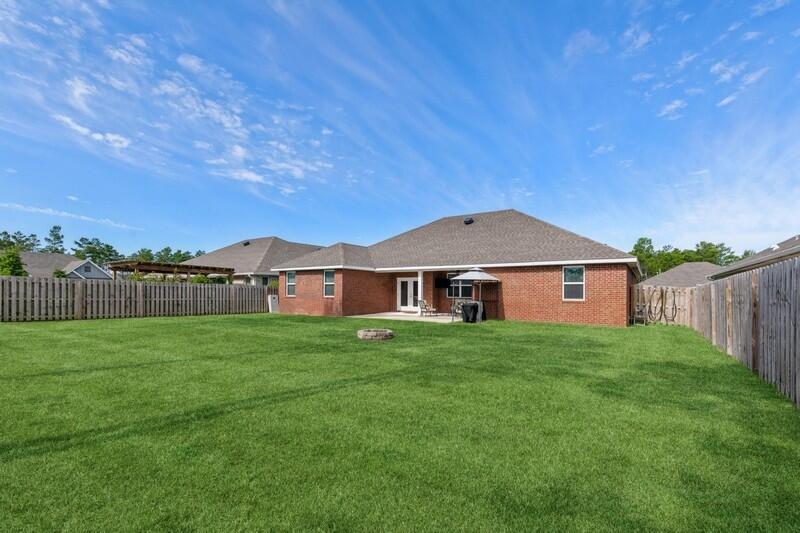 221 Sweet Tea Lane Freeport, FL 32439 - Photo 30 of 55 a house view with a garden space