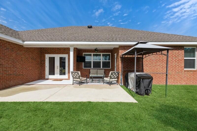 221 Sweet Tea Lane Freeport, FL 32439 - Photo 31 of 55 a house view with a sitting space and garden