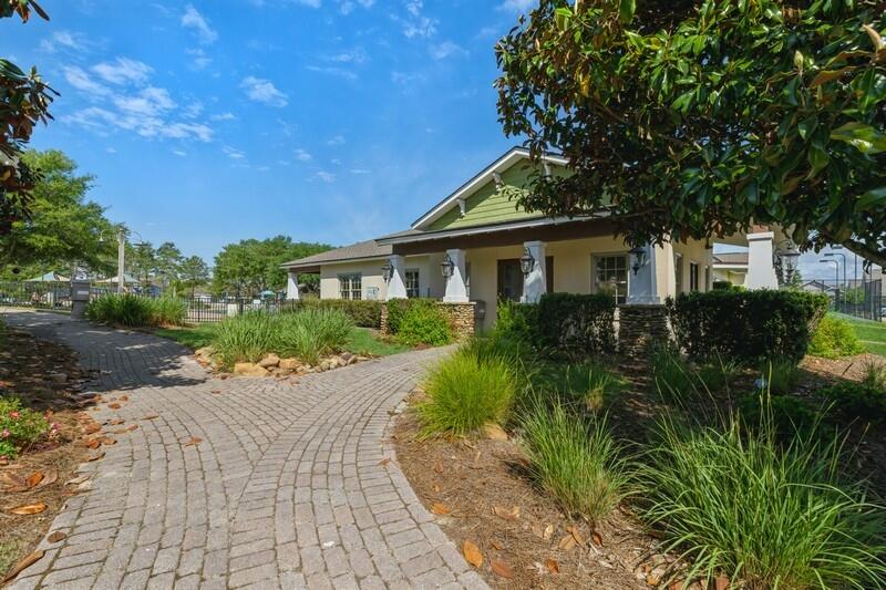 221 Sweet Tea Lane Freeport, FL 32439 - Photo 33 of 55 a front view of a house with a yard