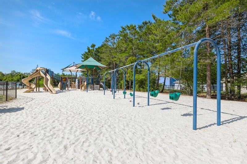 221 Sweet Tea Lane Freeport, FL 32439 - Photo 42 of 55 a view of a house with backyard and sitting area