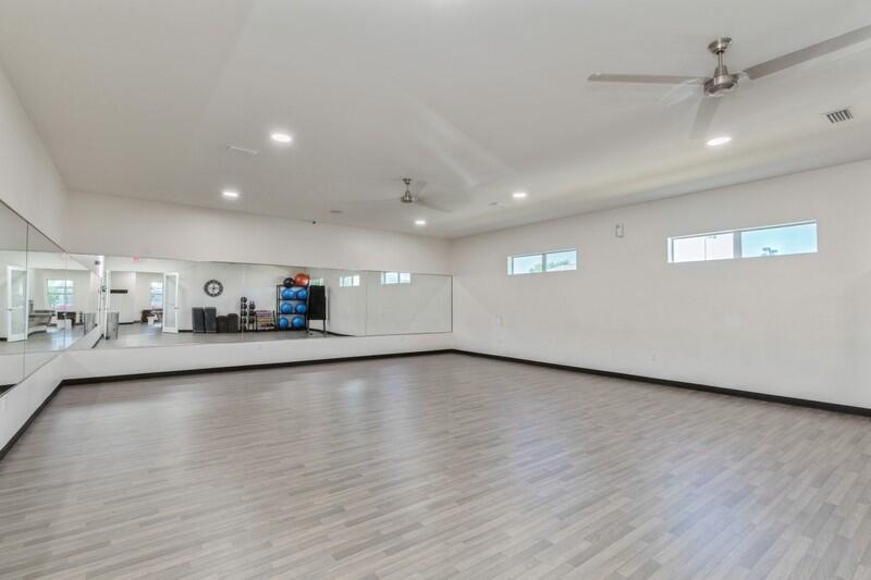 221 Sweet Tea Lane Freeport, FL 32439 - Photo 49 of 55 a view of a living room and kitchen with furniture
