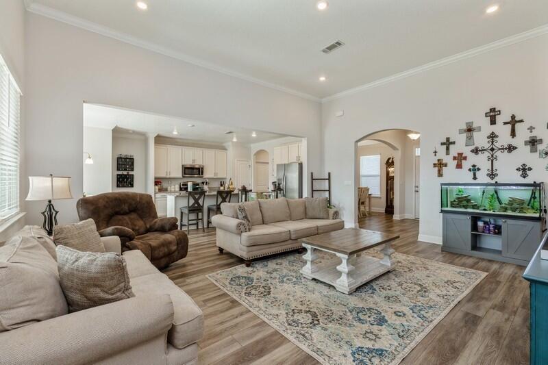 221 Sweet Tea Lane Freeport, FL 32439 - Photo 9 of 55 a living room with furniture and wooden floor