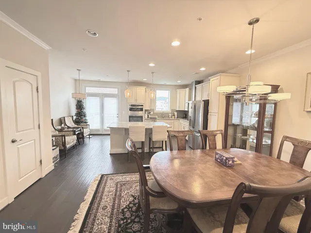 a large kitchen with a table and chairs