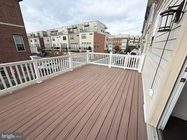 a view of balcony with wooden floor