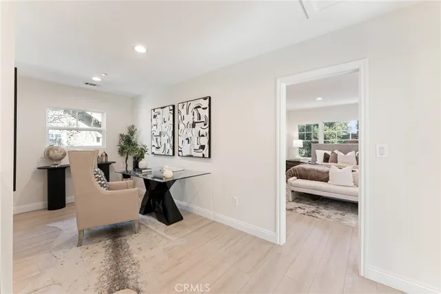 a view of a house with a yard porch and sitting area