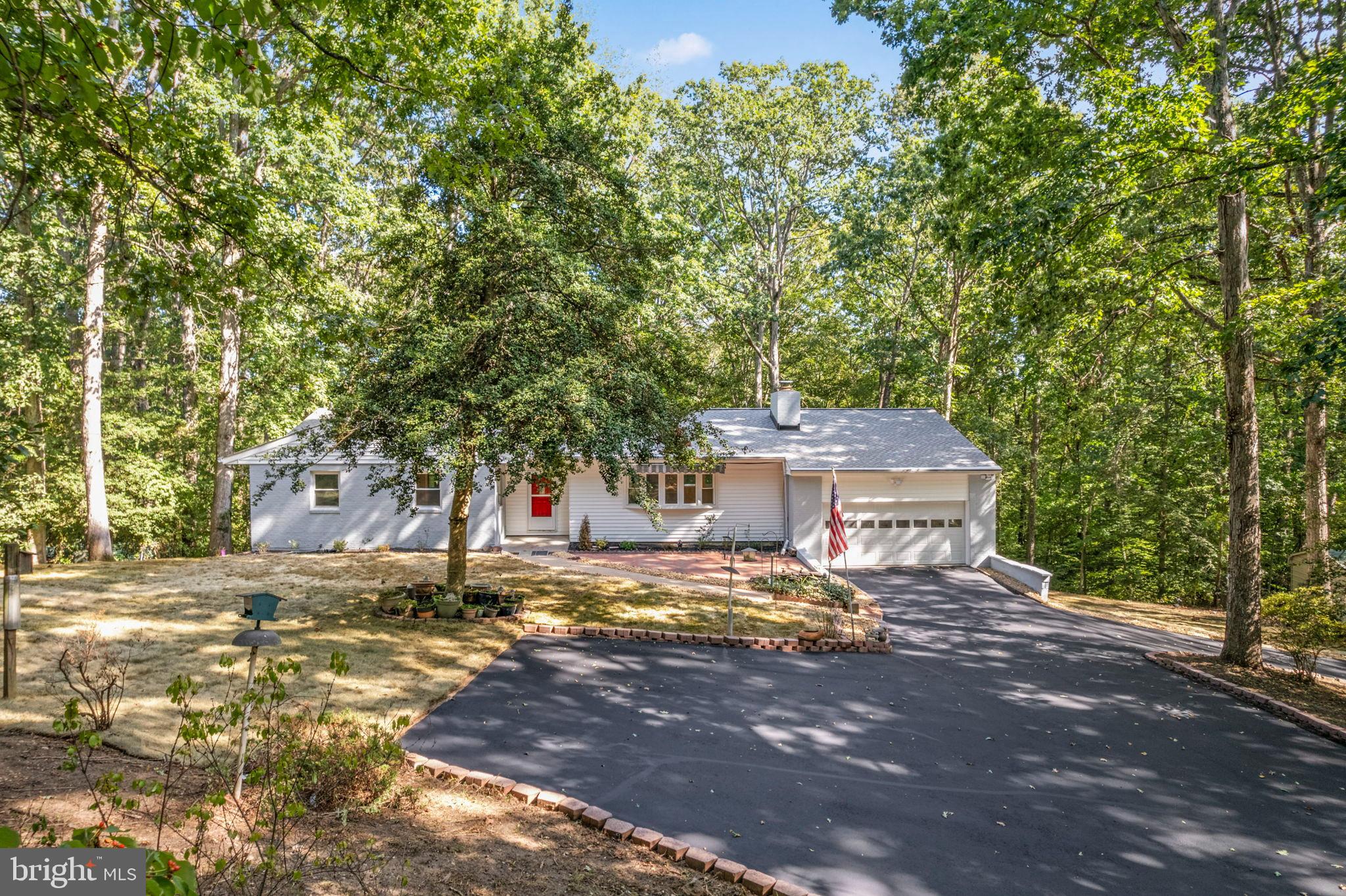 Charming home nestled among  trees on 8.77 acres