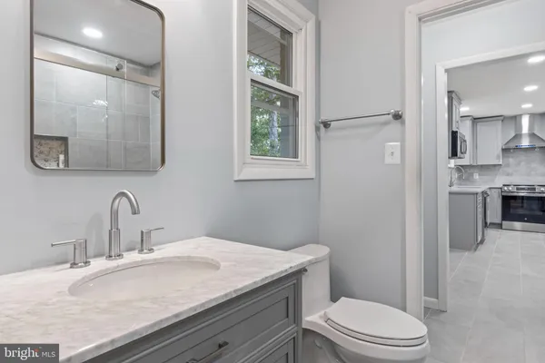 a bathroom with a bathtub and shower