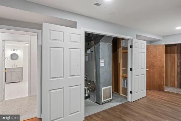 a bath tub sitting next to a bathroom sink