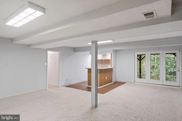 a aerial view of a house with swimming pool next to a yard