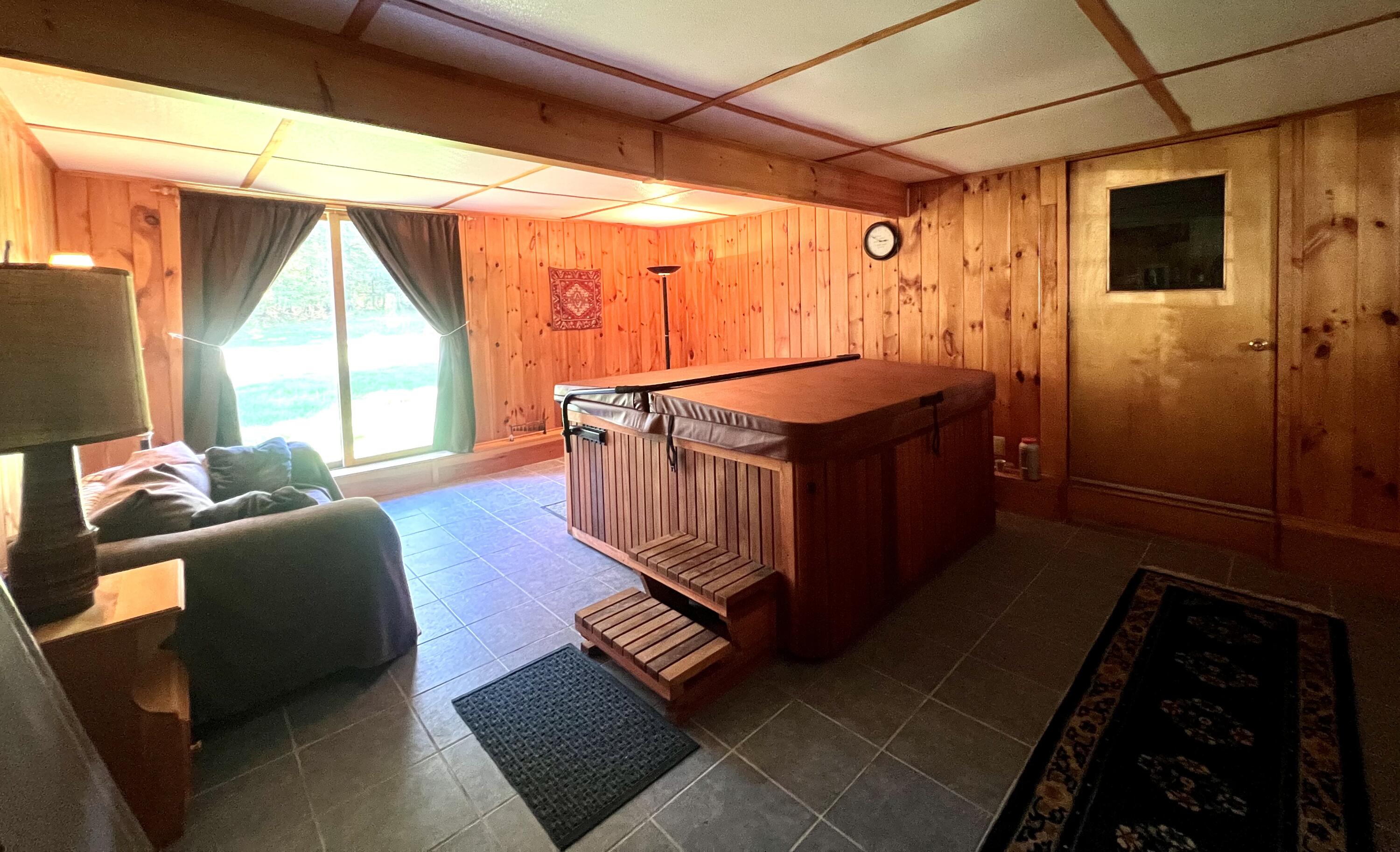 425 Phillips Road Weld, ME 04285 - Photo 29 of 56 Family Room w/ Hot Tub