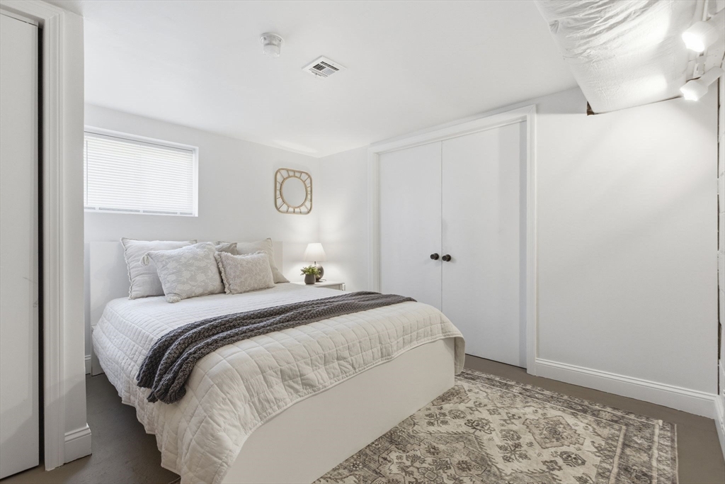 38 Woodland Road Georgetown, MA 01833 - Photo 32 of 42 a bedroom with a bed and a window