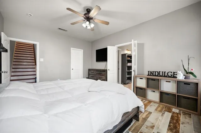 a spacious bathroom with a double vanity sink a mirror and a bathtub