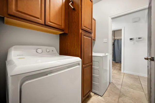 a view of a backyard with a garden and entertaining space