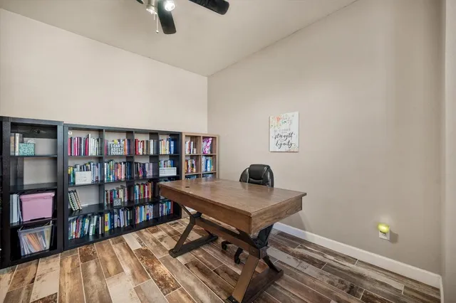 a workspace with furniture and a book shelf