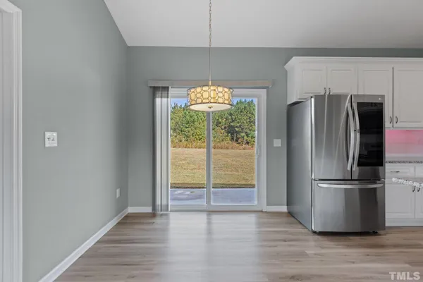 a kitchen with a refrigerator and countertop