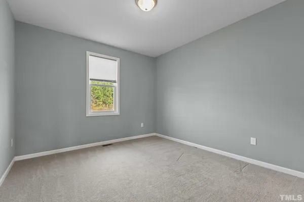 an empty room with closet area
