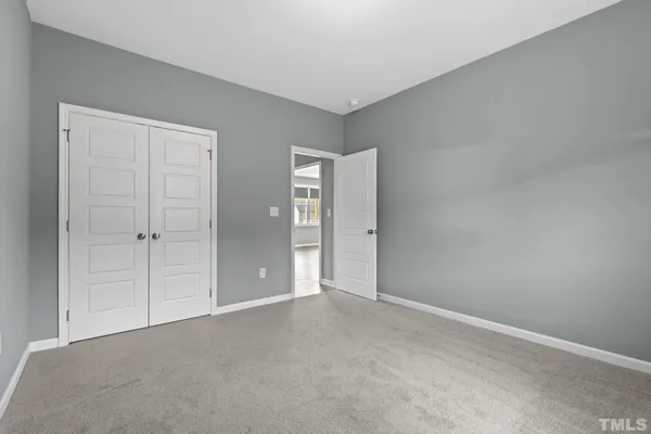 a view of a house with a swimming pool and a yard