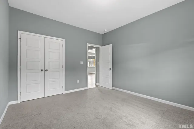 a view of a house with a swimming pool and a yard