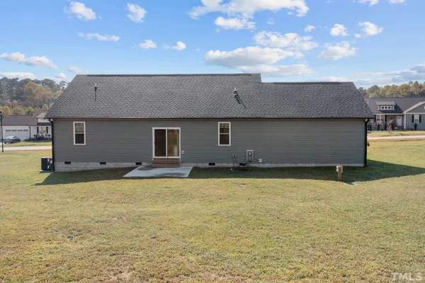 a backyard of a house with seating space