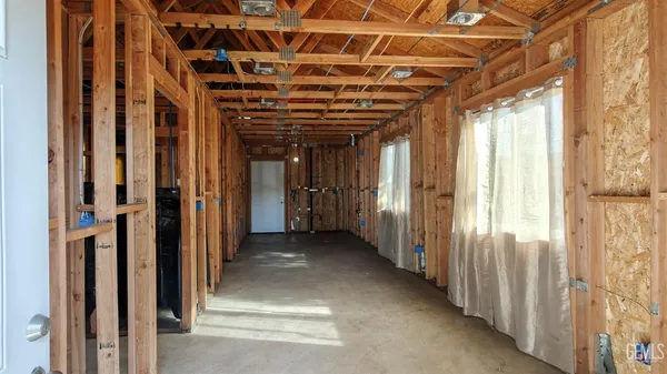 a view of a room with wooden walls