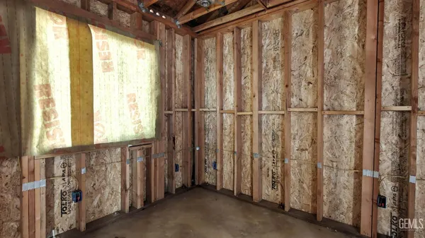a view of a patio with a table and chairs