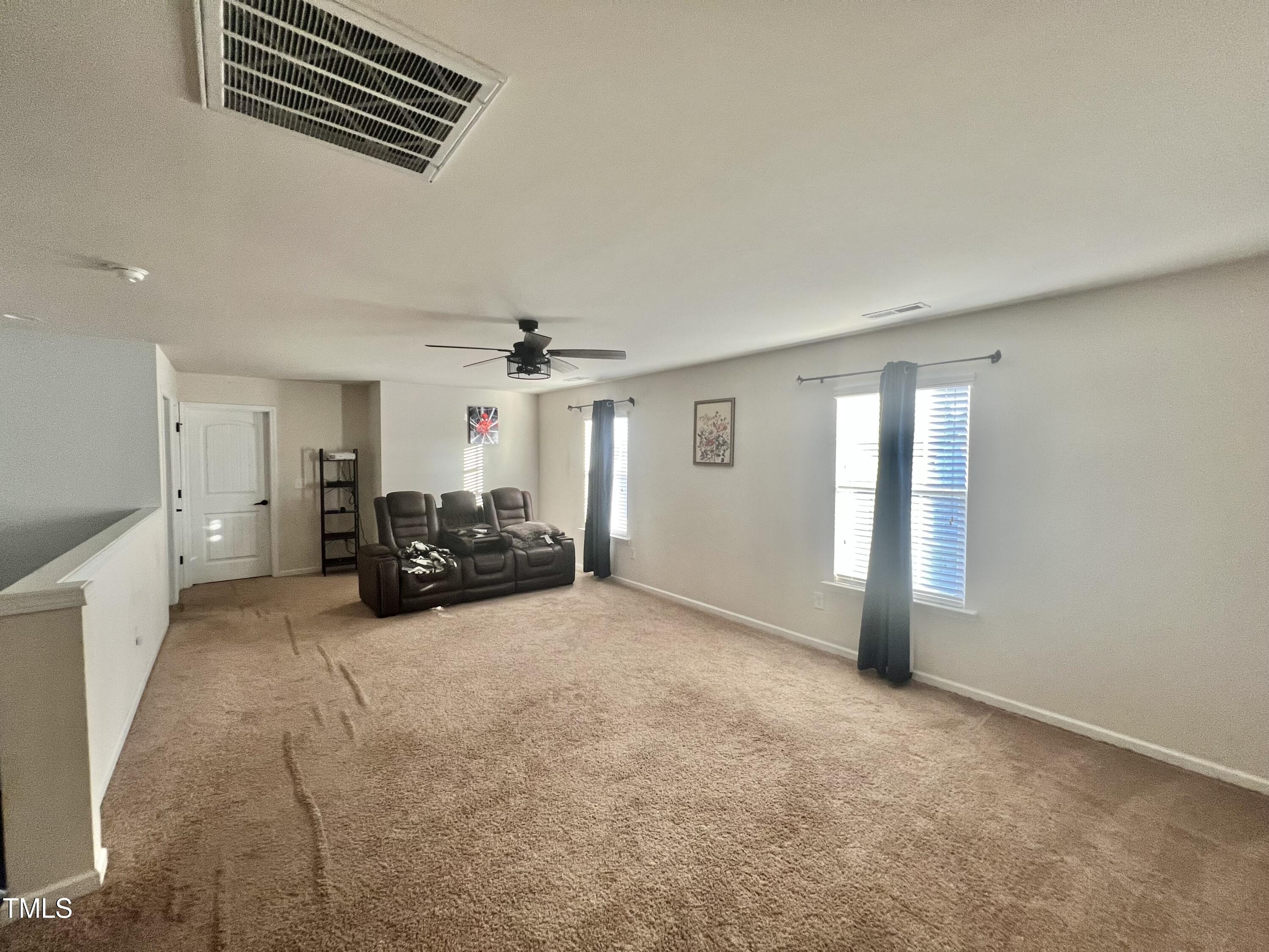 2652 Averon Drive Fuquay-Varina, NC 27526 - Photo 11 of 11 a view of a livingroom with furniture and a ceiling fan