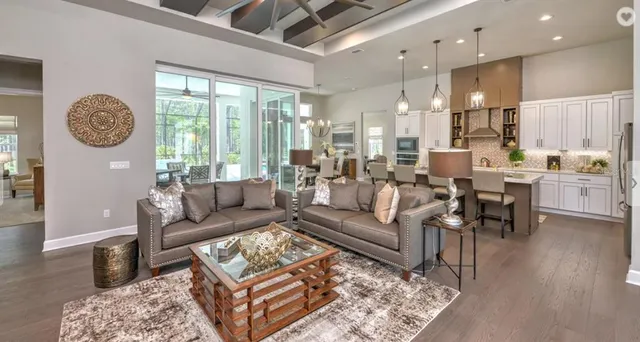 a spacious bathroom with a double vanity sink a large mirror and shower