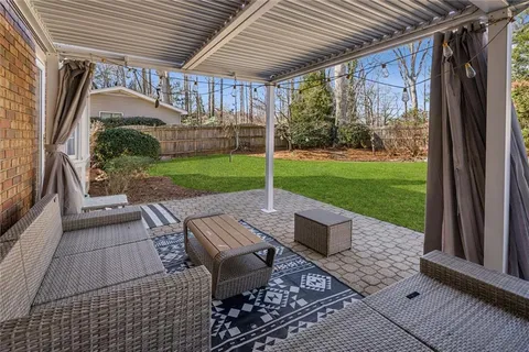 a view of yard with patio