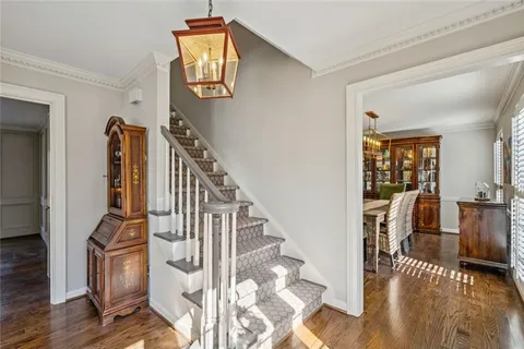 a view of entryway and hall with wooden floor