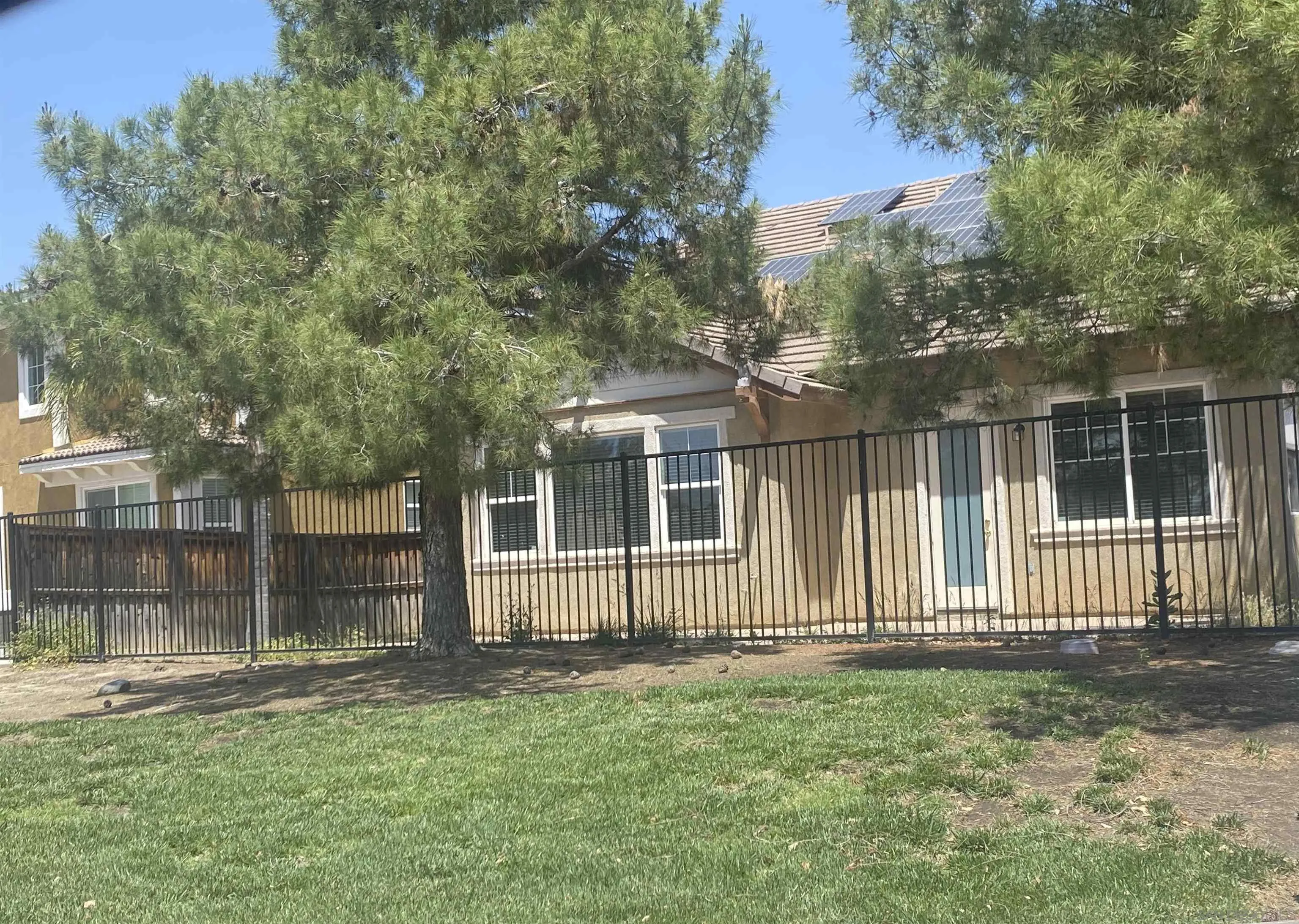 1301 Bee Balm Road Hemet, CA 92545 - Photo 2 of 17 a front view of a house with a garden