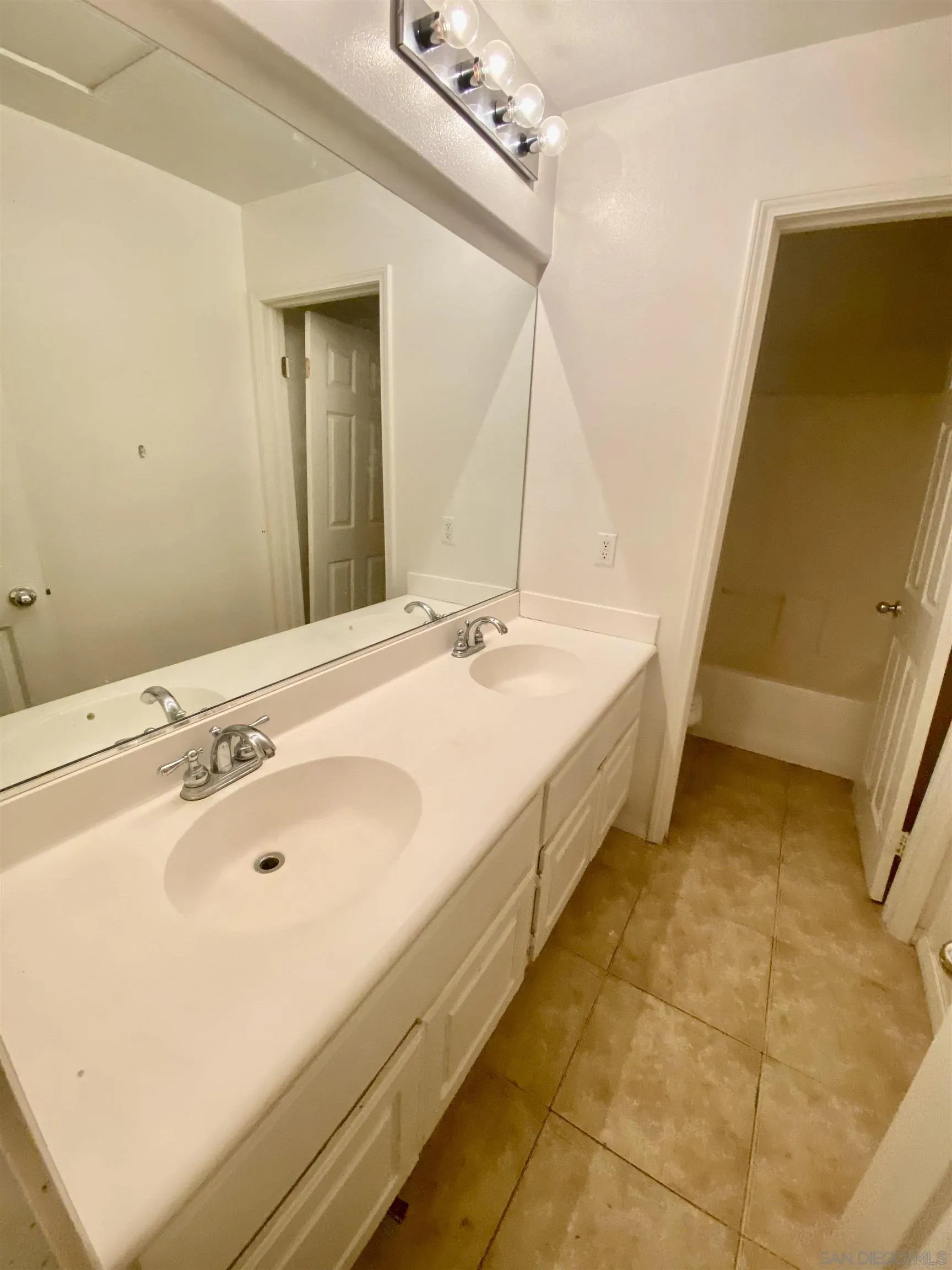 1301 Bee Balm Road Hemet, CA 92545 - Photo 8 of 17 a spacious bathroom with a sink and a mirror