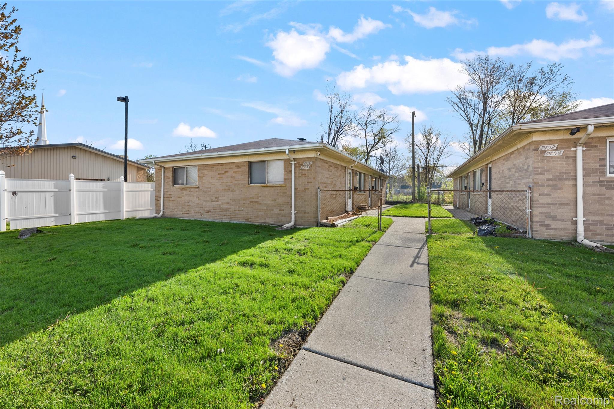 7440-7438 Southfield Road Detroit, MI 48228 - Photo 9 of 24 View of property exterior featuring brick siding