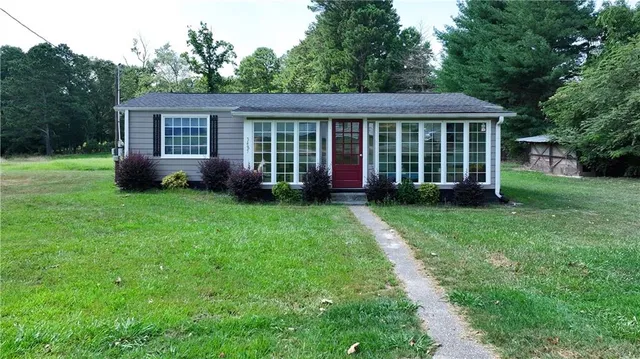 a view of a house with a yard