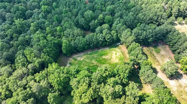 a view of a table and chairs under an umbrella