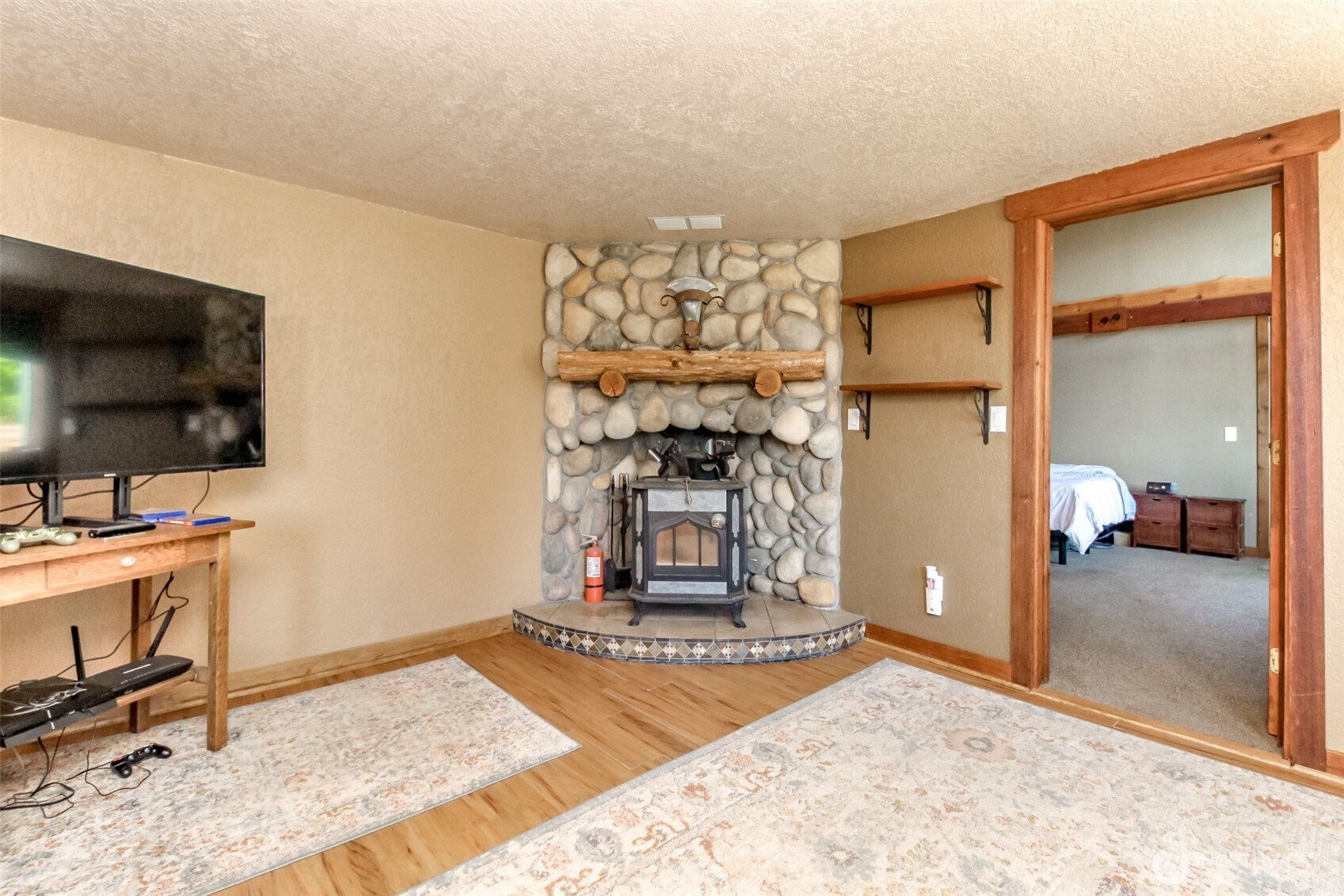 3116 Harts Lake Road South Roy, WA 98580 - Photo 15 of 39 a view of a livingroom with a flat screen tv