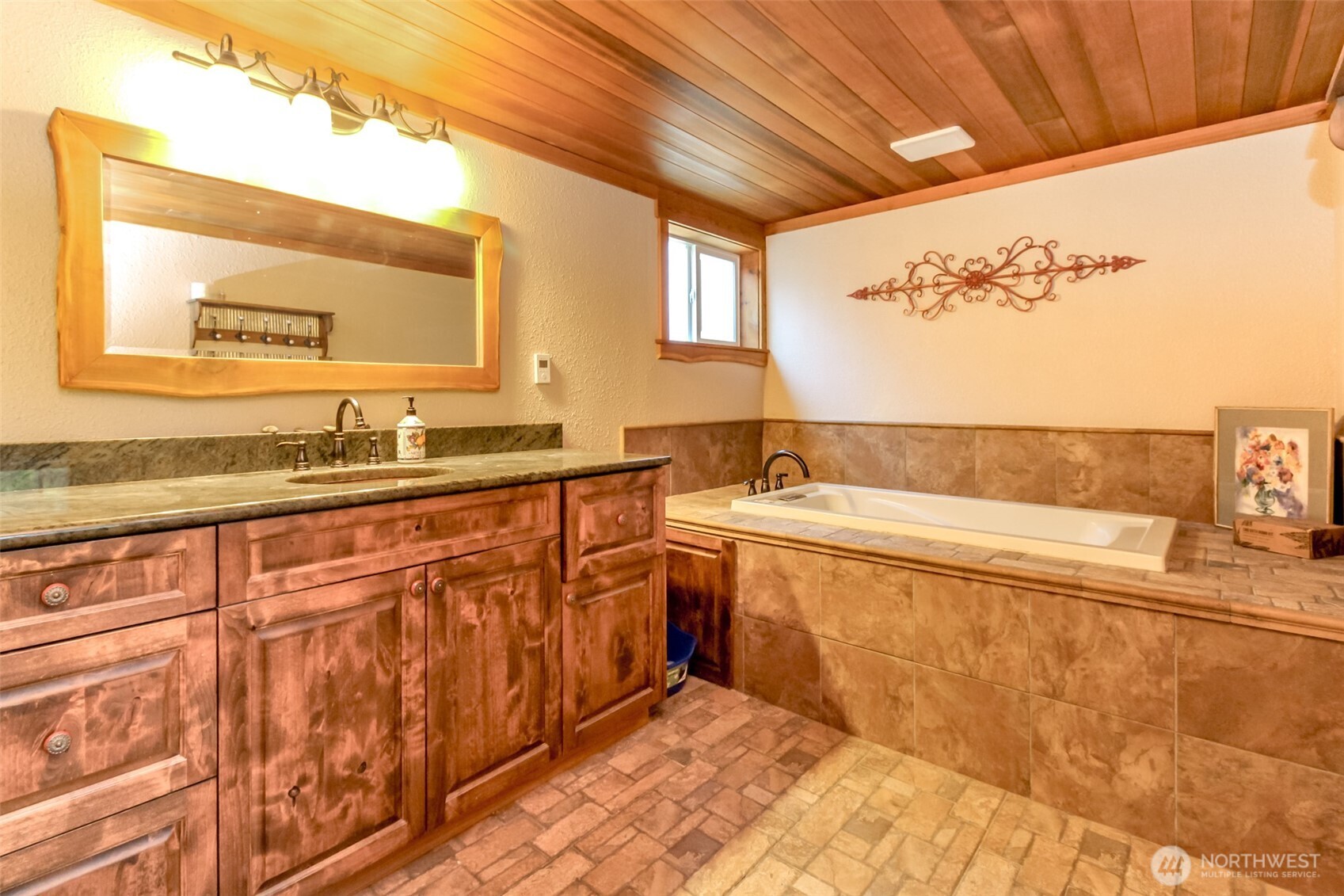 3116 Harts Lake Road South Roy, WA 98580 - Photo 19 of 39 a spacious bathroom with a sink and mirror
