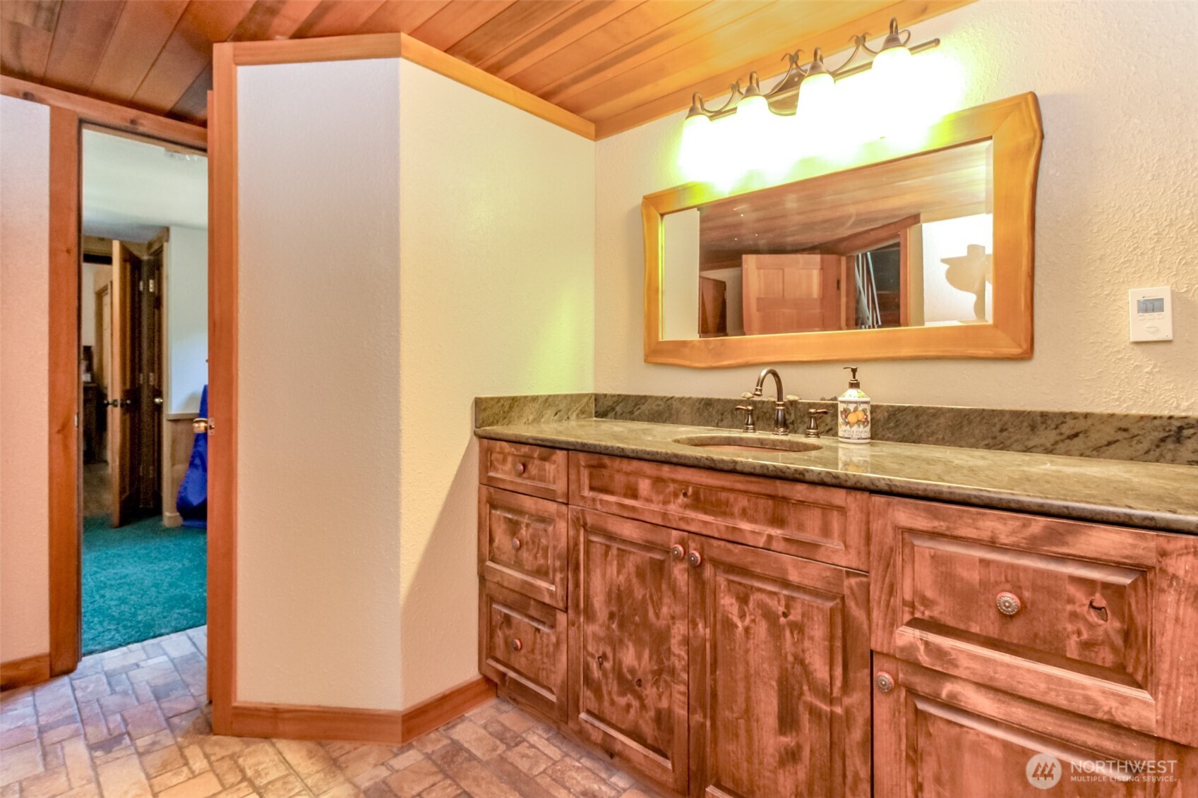 3116 Harts Lake Road South Roy, WA 98580 - Photo 20 of 39 a bathroom with a granite countertop sink and a mirror