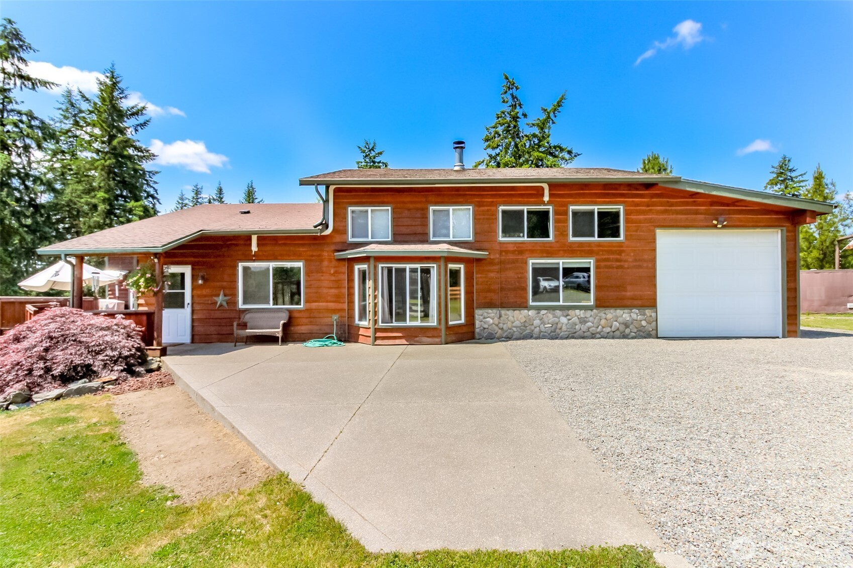 3116 Harts Lake Road South Roy, WA 98580 - Photo 2 of 39 a front view of a house with a yard