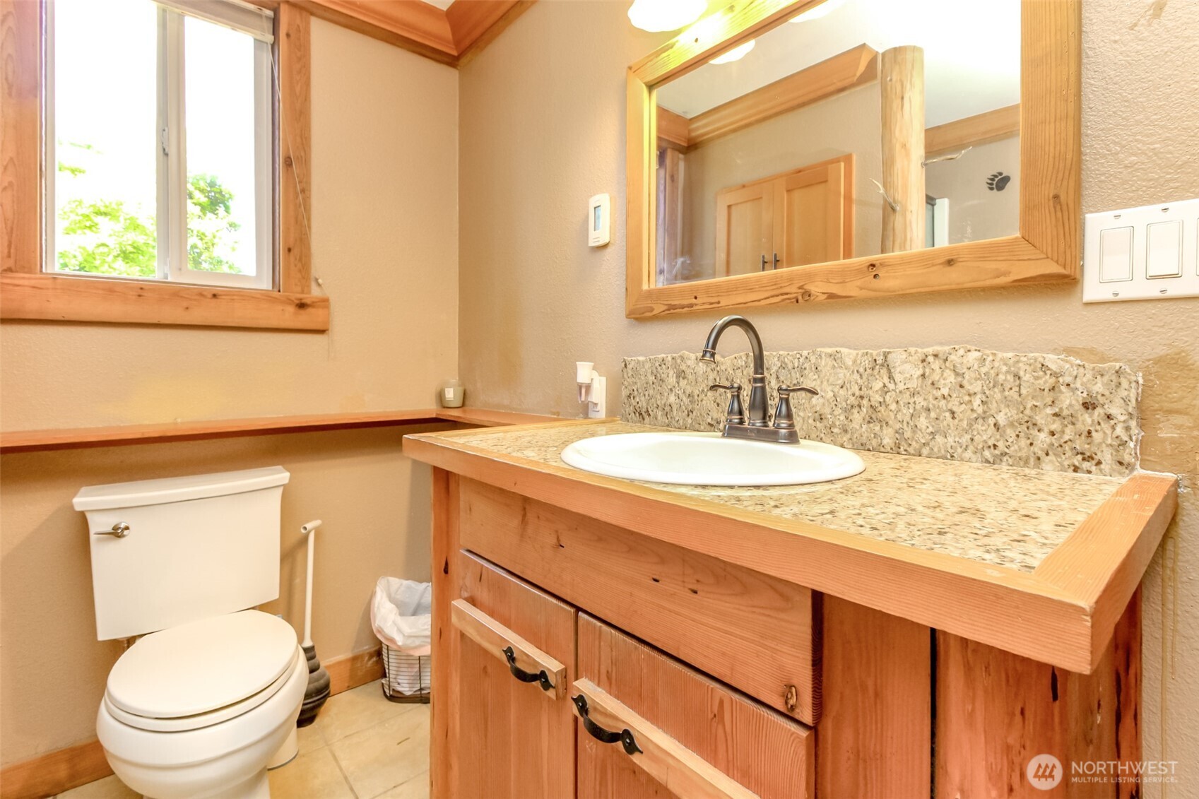 3116 Harts Lake Road South Roy, WA 98580 - Photo 21 of 39 a bathroom with a granite countertop toilet sink and mirror