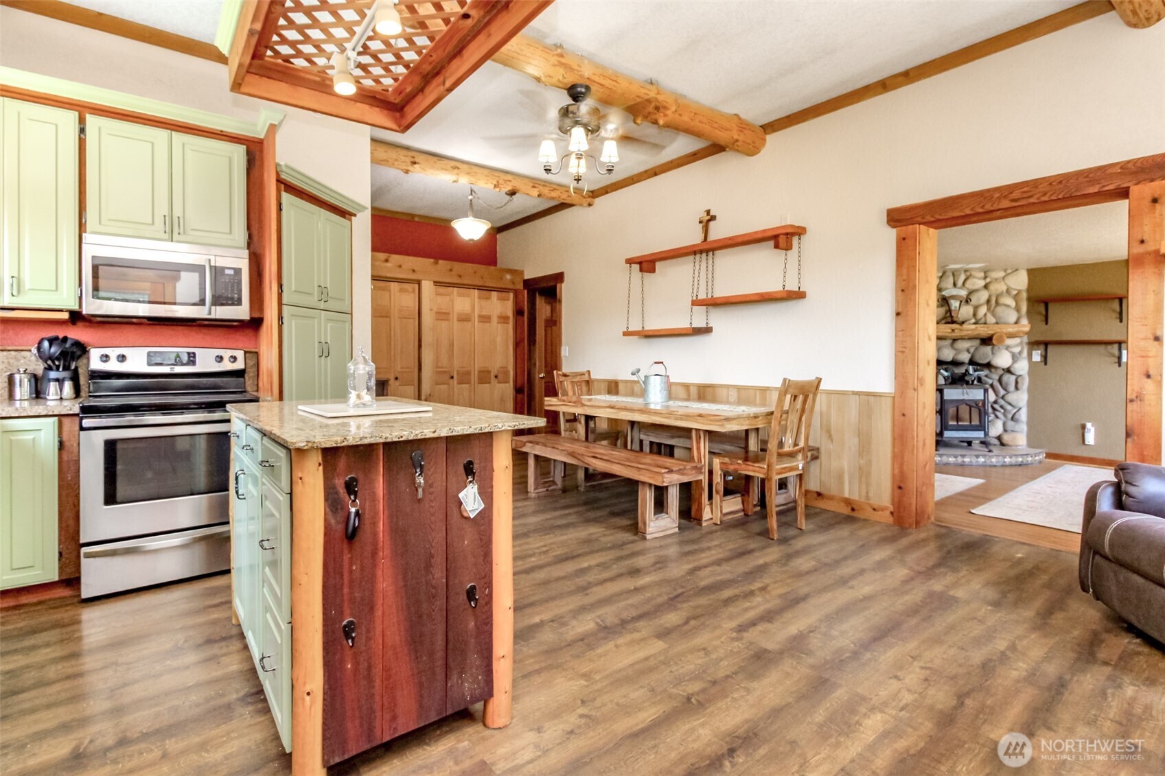 3116 Harts Lake Road South Roy, WA 98580 - Photo 8 of 39 a living room with stainless steel appliances kitchen island granite countertop a stove and a refrigerator
