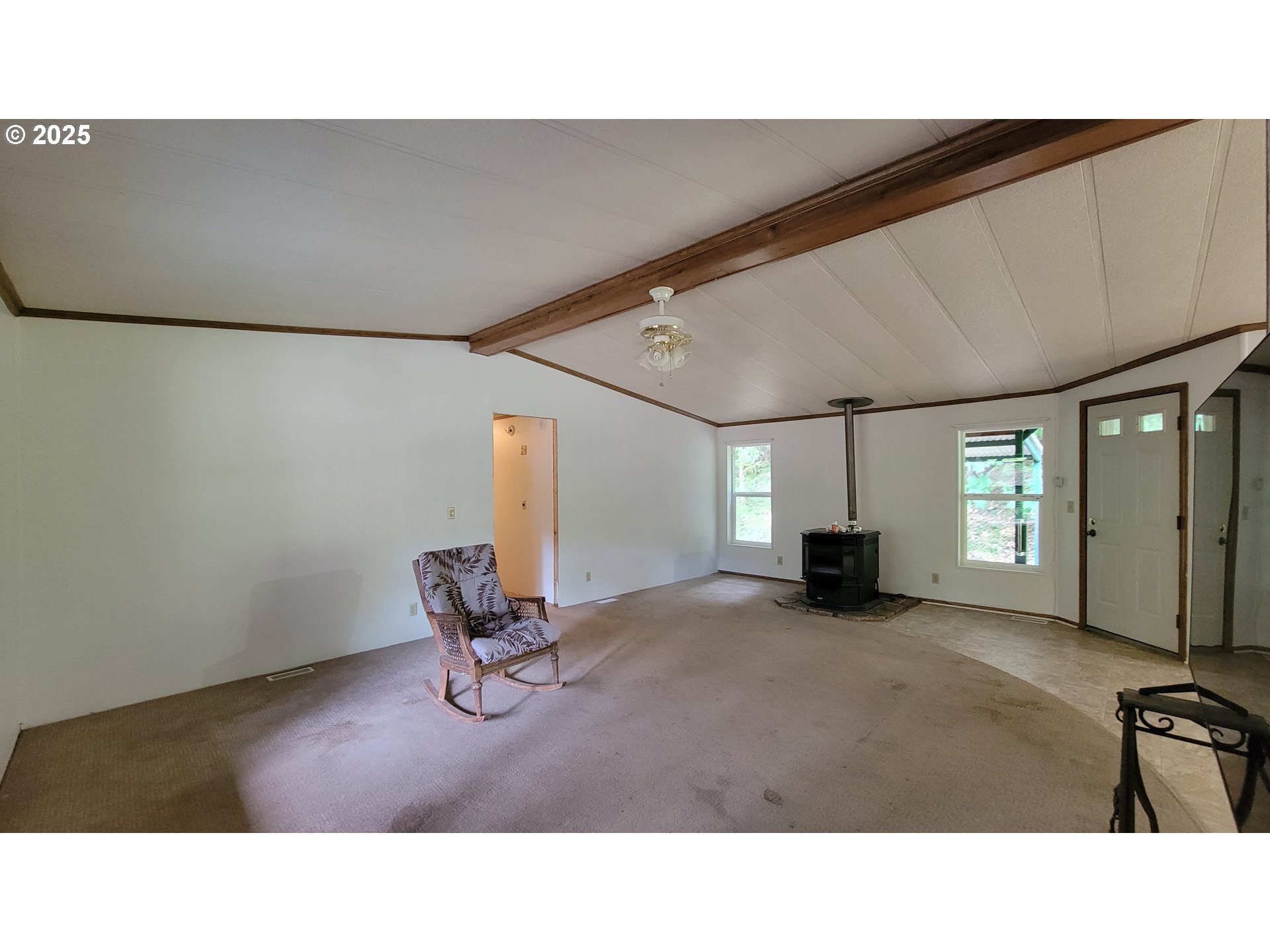 1097 Lees Creek Road Myrtle Creek, OR 97457 - Photo 12 of 41 a living room with furniture and a flat screen tv