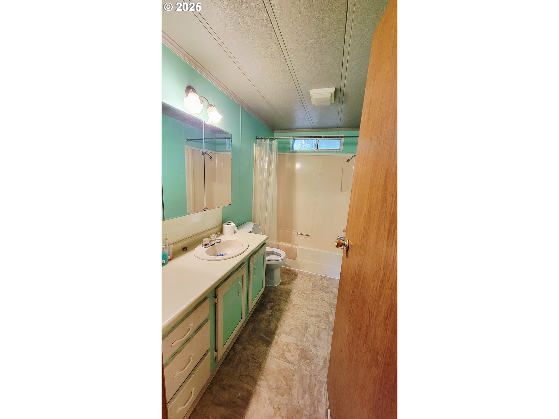 1097 Lees Creek Road Myrtle Creek, OR 97457 - Photo 24 of 41 a bathroom with a sink and a mirror